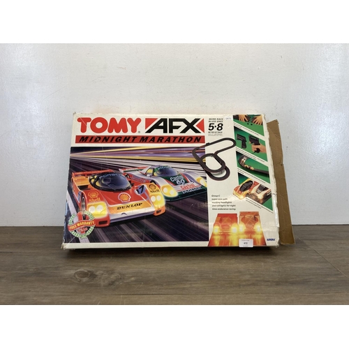 472 - A vintage boxed Tomy AFX Midnight Marathon slot car set