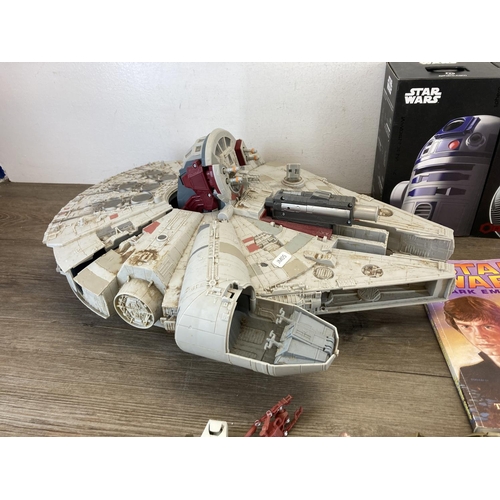 474 - A collection of Star Wars collectables to include Hasbro Millennium Falcon, Hasbro figurines, Sphero... 