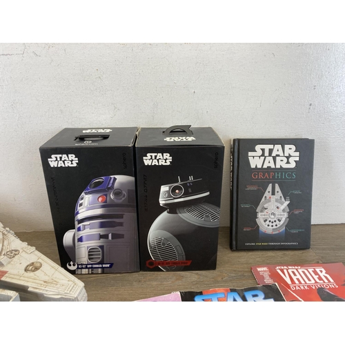 474 - A collection of Star Wars collectables to include Hasbro Millennium Falcon, Hasbro figurines, Sphero... 