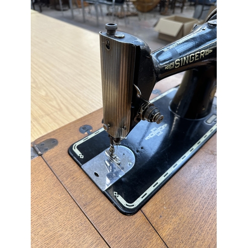 783 - A 1951 Singer 201K treadle sewing machine with accessories and instruction manual - approx. 76cm hig... 