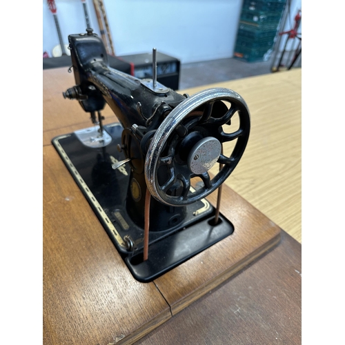 783 - A 1951 Singer 201K treadle sewing machine with accessories and instruction manual - approx. 76cm hig... 