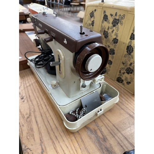 785 - A Jones electric sewing machine with foot pedal