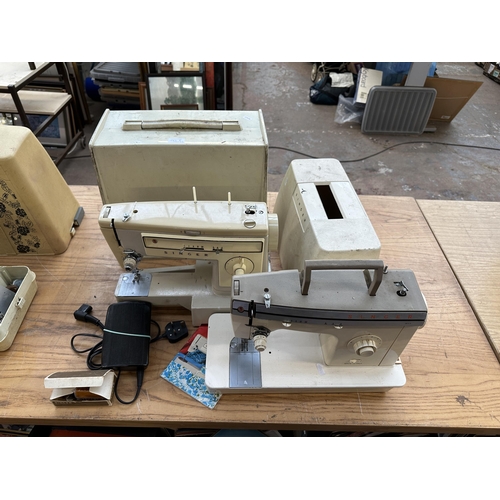 785A - Two cased Singer electric sewing machines, one 522 with foot pedal and instruction manual and one 37... 