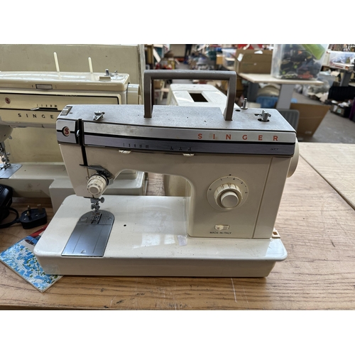 785A - Two cased Singer electric sewing machines, one 522 with foot pedal and instruction manual and one 37... 