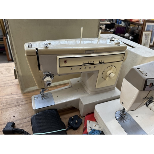 785A - Two cased Singer electric sewing machines, one 522 with foot pedal and instruction manual and one 37... 