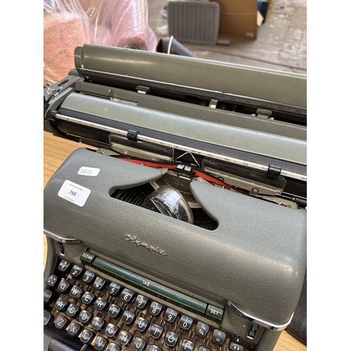 788 - A mid 20th century Olympia SG1 De Luxe wide-carriage desktop typewriter with cover and spare ribbon