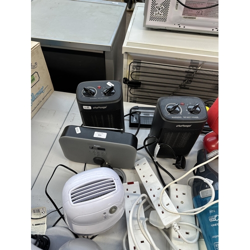 803 - A collection of electrical items to include two Challenge fan heaters, Bush DAB radio, Acoustic Solu... 