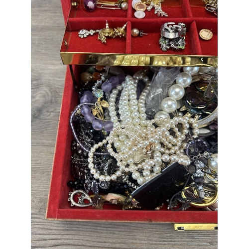 505 - A jewellery box containing a collection of costume jewellery to include simulated pearl necklaces, e... 