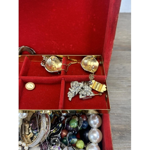 505 - A jewellery box containing a collection of costume jewellery to include simulated pearl necklaces, e... 