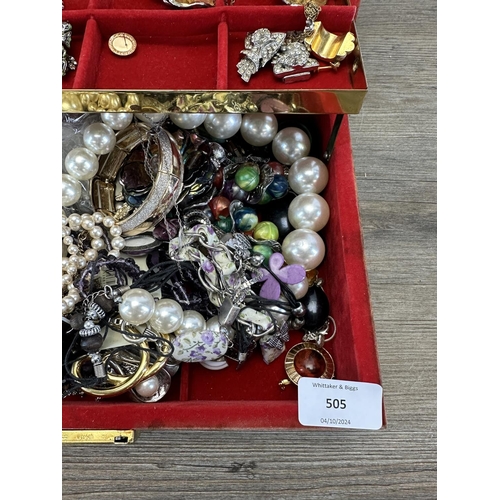 505 - A jewellery box containing a collection of costume jewellery to include simulated pearl necklaces, e... 