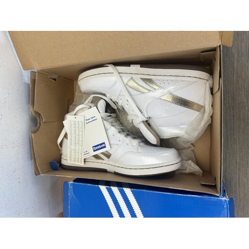 514 - Three pairs of boxed trainers, one pair of Reebok Classic white and gold high tops - size 6, one pai... 