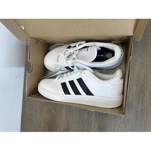 514 - Three pairs of boxed trainers, one pair of Reebok Classic white and gold high tops - size 6, one pai... 