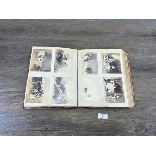 519 - An early 20th century photograph album containing a collection of black and white photographs and cu... 