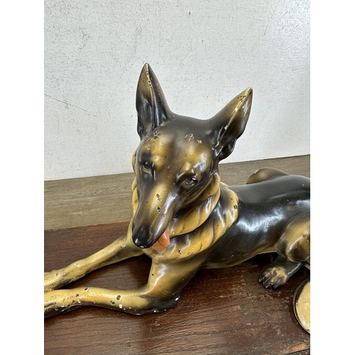 526 - A 1930s Wade ceramic Alsatian figurine on carved oak presentation plinth