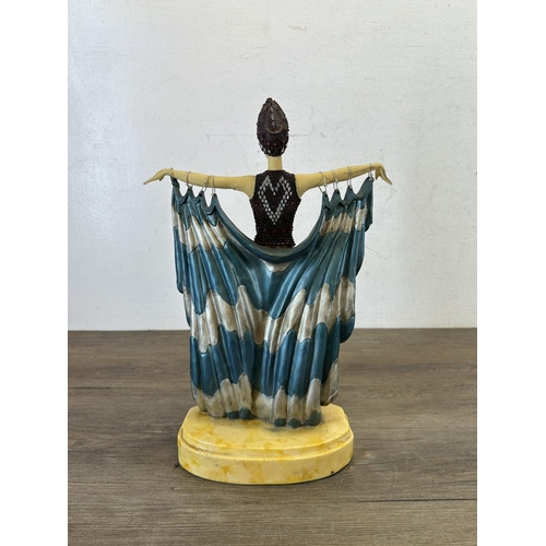 554 - An Art Deco style resin figurine - approx. 38cm high