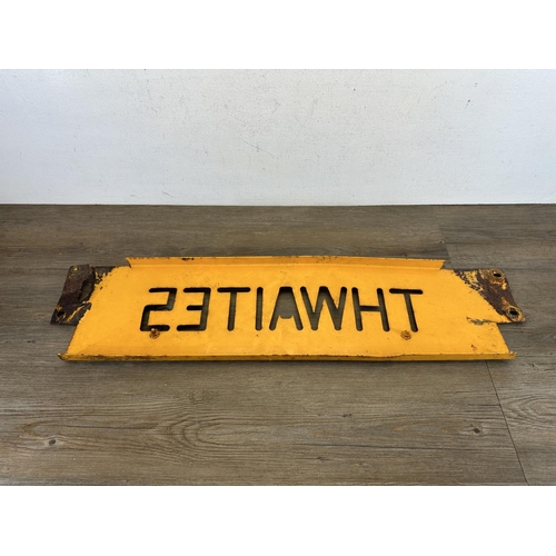 558 - A vintage Thwaites yellow metal advertising sign - approx. 92cm wide x 22cm high