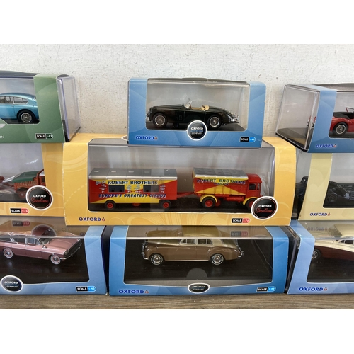 491 - Eleven boxed Oxford diecast model vehicles to include Aston Martin, Military, Showtime etc.