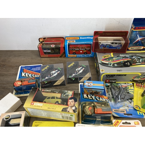 492 - A collection of boxed diecast model vehicles to include Corgi, Bburago, Matchbox, Onyx etc.