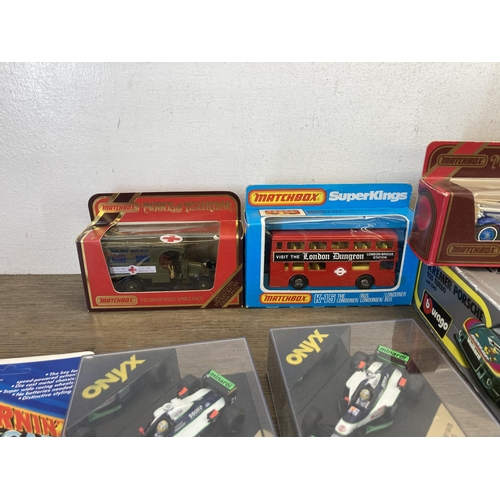 492 - A collection of boxed diecast model vehicles to include Corgi, Bburago, Matchbox, Onyx etc.