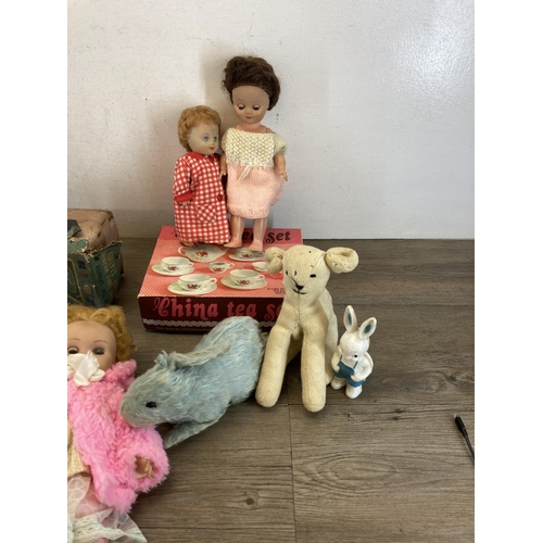 494 - A collection of mid 20th century toys and dolls to include boxed battery operated Distant Early Warn... 