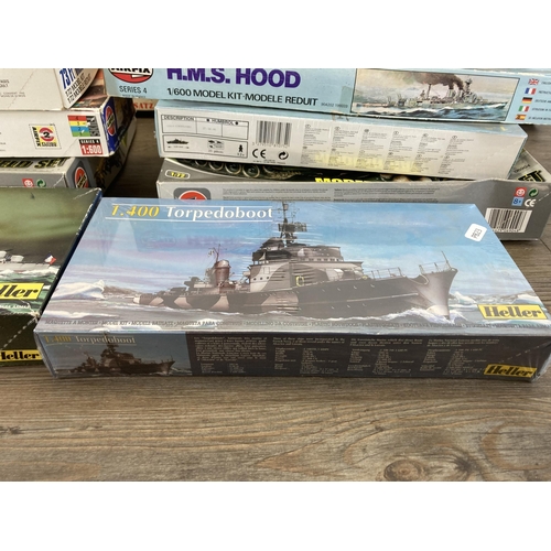 498 - A large collection of model kits to include Airfix, Revell, Heller etc.