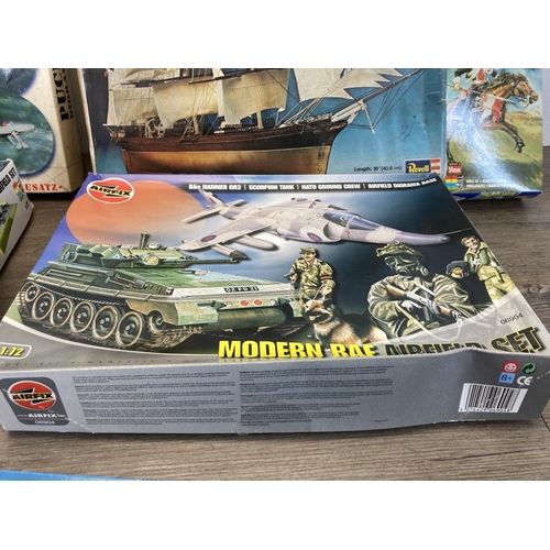 498 - A large collection of model kits to include Airfix, Revell, Heller etc.