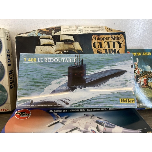 498 - A large collection of model kits to include Airfix, Revell, Heller etc.