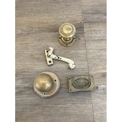 396 - A large collection of antique and later brass window and door fixtures and fittings