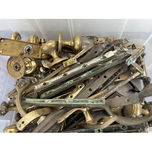 396 - A large collection of antique and later brass window and door fixtures and fittings