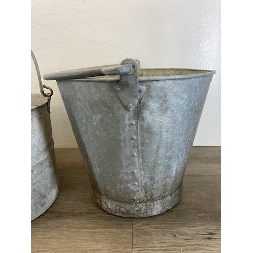 407 - Three vintage galvanized items, one rivetted bucket - approx. 33cm high x 35cm diameter and two mop ... 