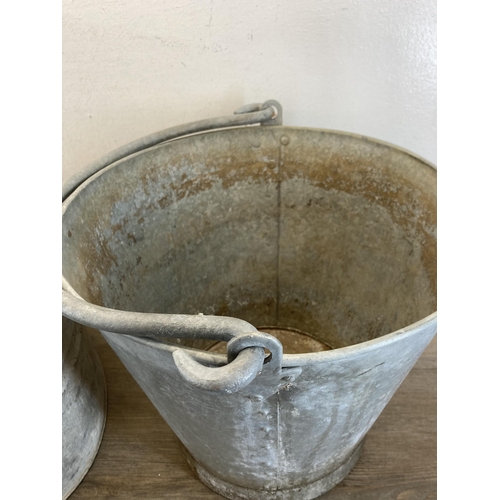 407 - Three vintage galvanized items, one rivetted bucket - approx. 33cm high x 35cm diameter and two mop ... 