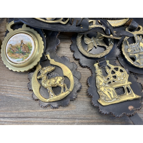 412 - A collection of antique and later metalware to include horse brasses, chamberstick, American style w... 