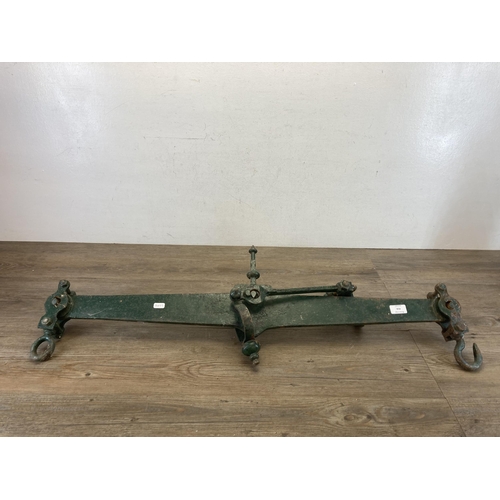 416 - A pair of 19th century cast iron and green painted industrial hoisted weighing scales