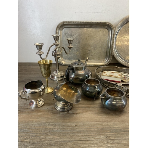 418 - A collection of vintage metalware to include serving trays, four piece C.B & S Ltd. tea set etc.