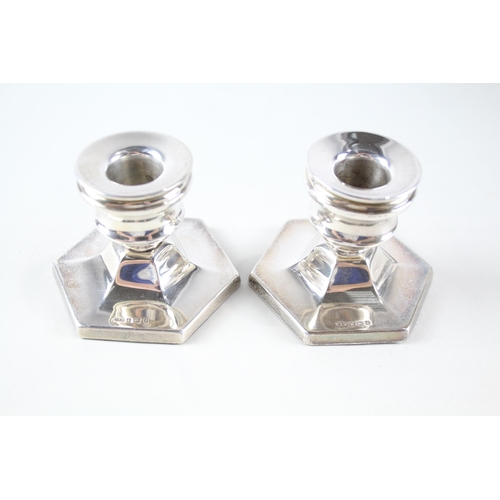 2235 - Two hallmarked Birmingham silver weighted candlesticks, dated 1967 - approx. gross weight 381g and 6... 