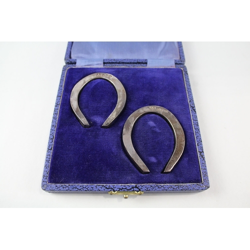 2242 - Two boxed hallmarked Sheffield silver lucky horse shoe ornaments - approx. gross weight 66g