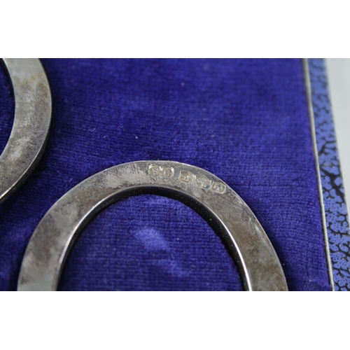 2242 - Two boxed hallmarked Sheffield silver lucky horse shoe ornaments - approx. gross weight 66g