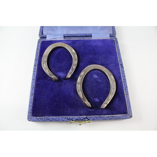 2242 - Two boxed hallmarked Sheffield silver lucky horse shoe ornaments - approx. gross weight 66g