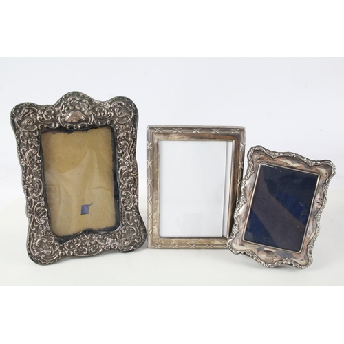 2243 - Three hallmarked sterling silver photograph frames - largest approx. 20cm high x 15cm wide