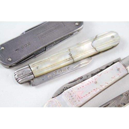 2256 - Four hallmarked sterling silver pocket knives, three mother of pearl handled and one silver handled ... 