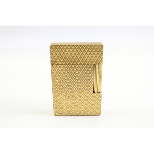 2268 - A St Dupont Paris gold plated and diamond cut hobnail pattern pocket lighter