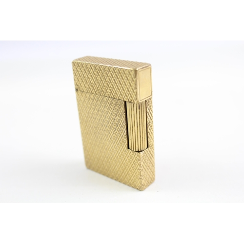 2268 - A St Dupont Paris gold plated and diamond cut hobnail pattern pocket lighter