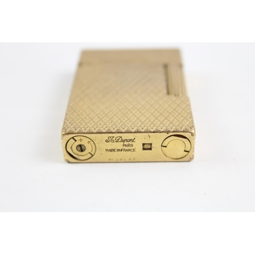 2268 - A St Dupont Paris gold plated and diamond cut hobnail pattern pocket lighter