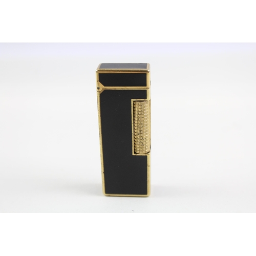 2270 - A Dunhill Rollagas brass and black lacquer pocket lighter