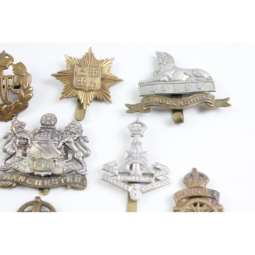 2273 - Ten military cap badges