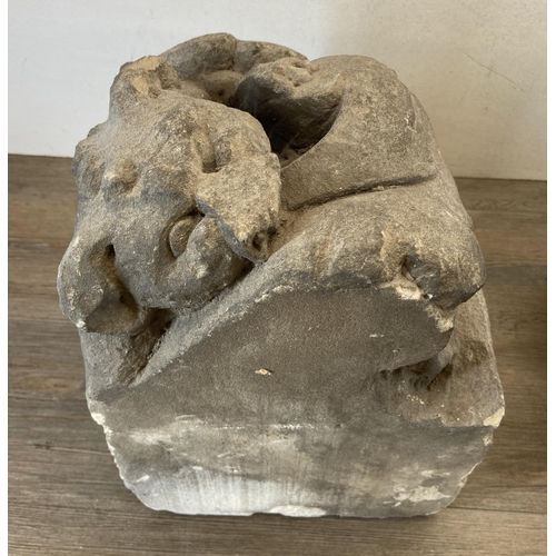 105 - Two medieval carved stone gargoyle corbels - largest approx. 39cm high x 25.5cm wide x 25.5cm deep