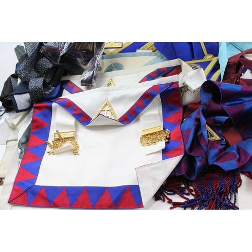 548 - A collection of Masonic regalia to include aprons, collars, gloves, jewel etc.