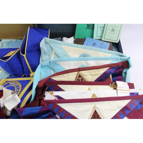 548 - A collection of Masonic regalia to include aprons, collars, gloves, jewel etc.