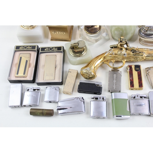 569 - A collection of cigarette and table lighters to include Ronson, Zippo, Colibri etc.