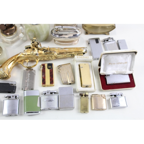 569 - A collection of cigarette and table lighters to include Ronson, Zippo, Colibri etc.